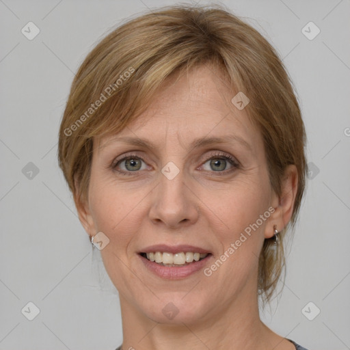 Joyful white adult female with medium  brown hair and grey eyes