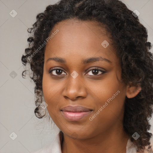 Joyful black young-adult female with medium  black hair and brown eyes