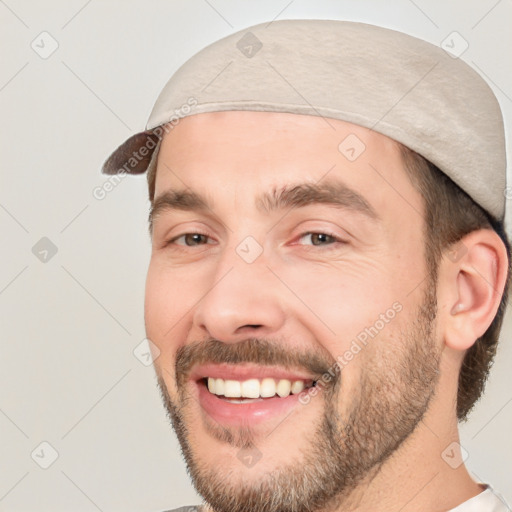 Joyful white adult male with short  brown hair and brown eyes