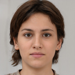 Neutral white young-adult female with medium  brown hair and brown eyes