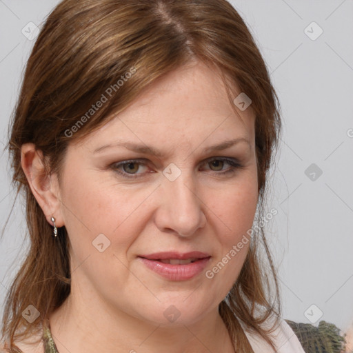 Joyful white adult female with medium  brown hair and brown eyes