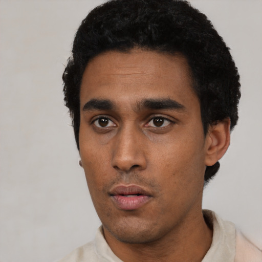 Neutral black young-adult male with short  black hair and brown eyes