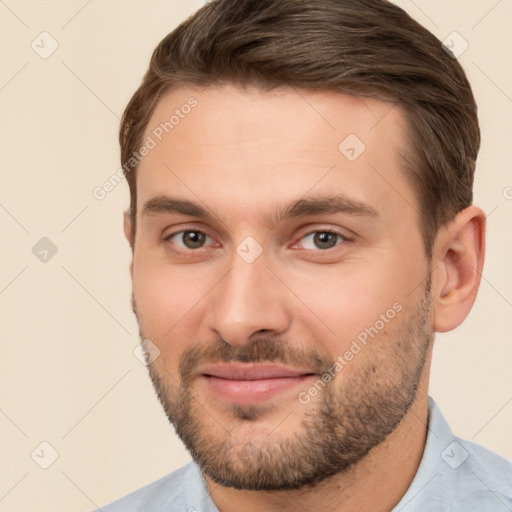 Joyful white young-adult male with short  brown hair and brown eyes