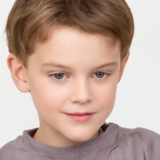 Joyful white child male with short  brown hair and brown eyes