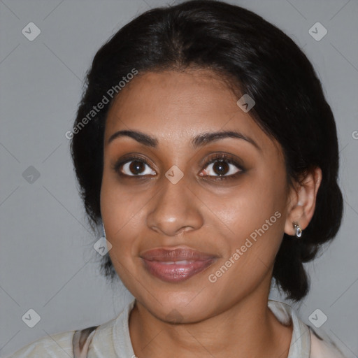 Joyful black young-adult female with medium  black hair and brown eyes