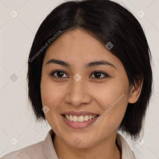 Joyful latino young-adult female with medium  brown hair and brown eyes