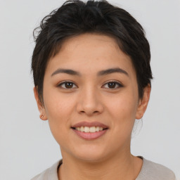 Joyful asian young-adult female with short  brown hair and brown eyes