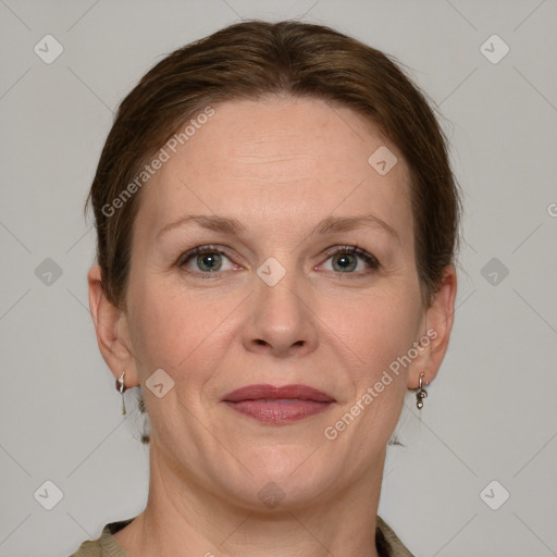 Joyful white adult female with short  brown hair and grey eyes