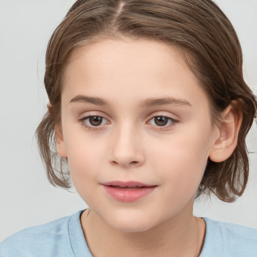 Joyful white child female with medium  brown hair and brown eyes