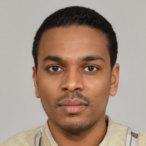 Neutral latino young-adult male with short  black hair and brown eyes
