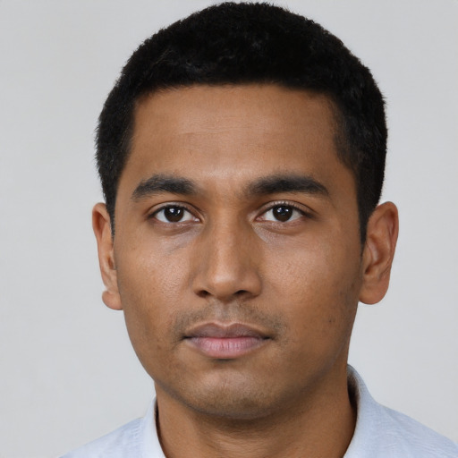 Neutral latino young-adult male with short  black hair and brown eyes