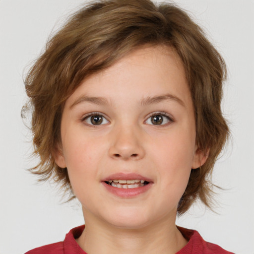 Joyful white child female with medium  brown hair and brown eyes