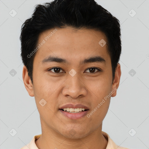 Joyful asian young-adult male with short  black hair and brown eyes