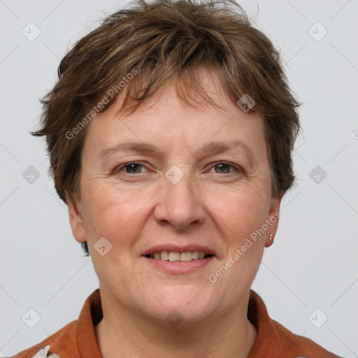 Joyful white adult female with short  brown hair and grey eyes