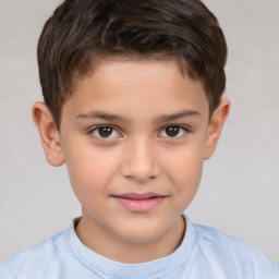 Joyful white child male with short  brown hair and brown eyes