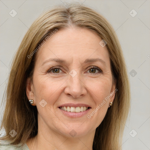 Joyful white adult female with medium  brown hair and grey eyes