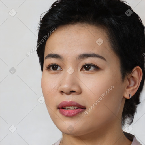 Joyful asian young-adult female with medium  black hair and brown eyes