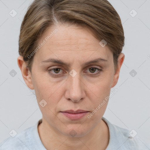 Joyful white adult female with short  brown hair and grey eyes