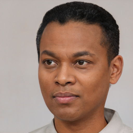Neutral black young-adult male with short  black hair and brown eyes