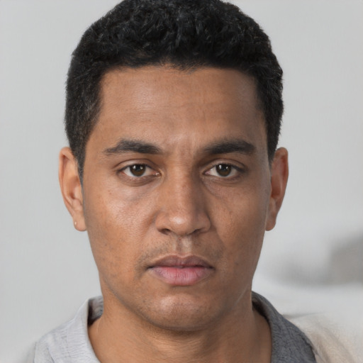 Neutral white young-adult male with short  black hair and brown eyes