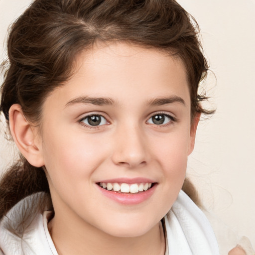 Joyful white child female with medium  brown hair and brown eyes