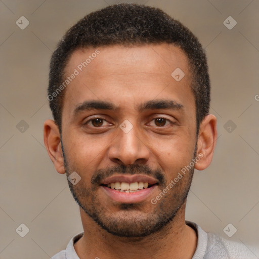 Joyful black young-adult male with short  black hair and brown eyes