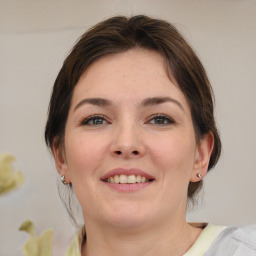 Joyful white young-adult female with medium  brown hair and brown eyes