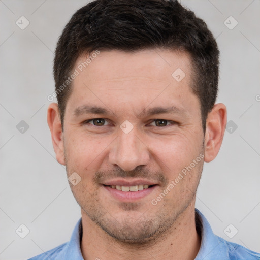 Joyful white adult male with short  brown hair and brown eyes