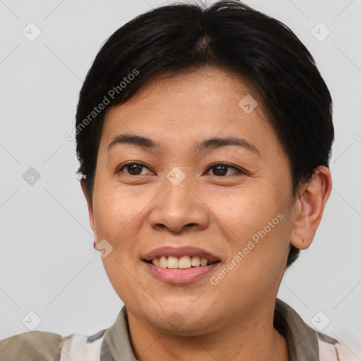 Joyful asian adult female with short  brown hair and brown eyes