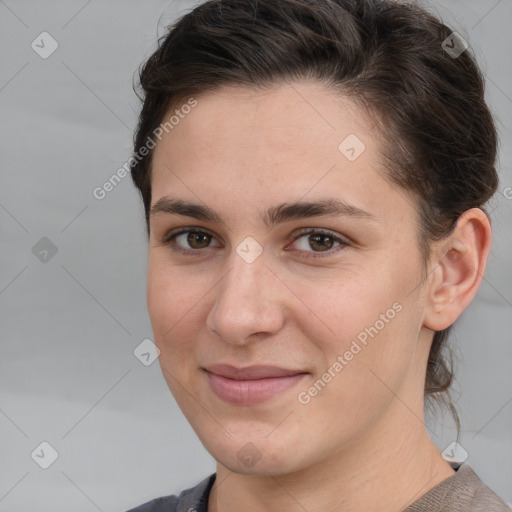 Joyful white young-adult female with short  brown hair and brown eyes