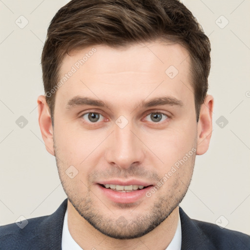 Joyful white young-adult male with short  brown hair and grey eyes