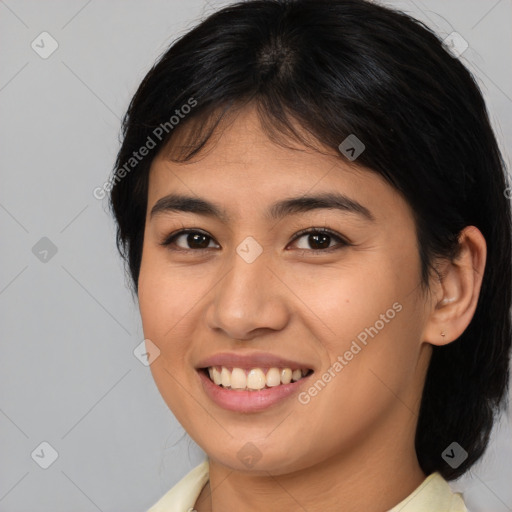 Joyful asian young-adult female with medium  brown hair and brown eyes