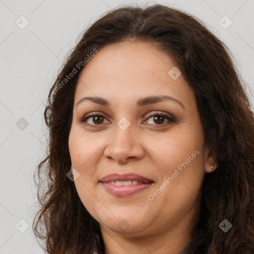 Joyful white adult female with long  brown hair and brown eyes