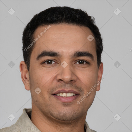Joyful white young-adult male with short  black hair and brown eyes