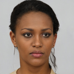 Neutral black young-adult female with short  brown hair and brown eyes