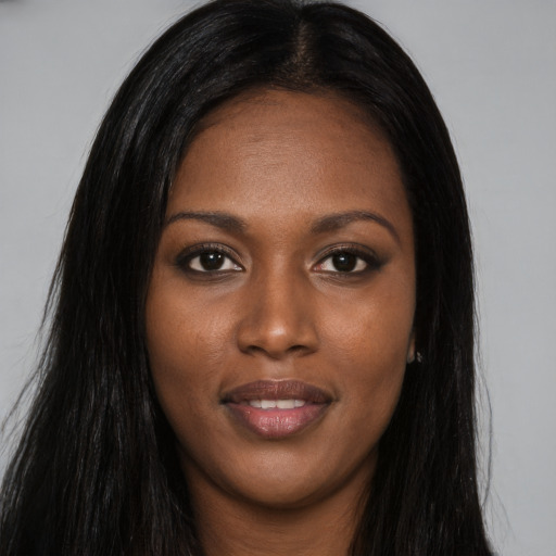 Joyful asian young-adult female with long  black hair and brown eyes