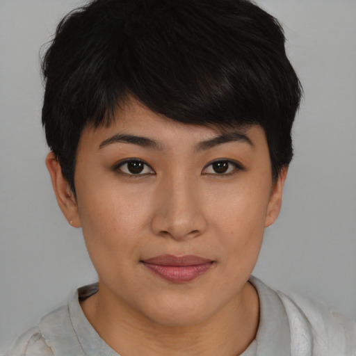 Joyful asian young-adult female with short  brown hair and brown eyes
