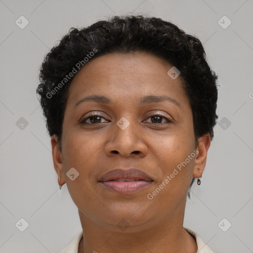 Joyful black adult female with short  brown hair and brown eyes