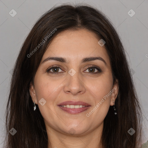 Joyful white adult female with long  brown hair and brown eyes