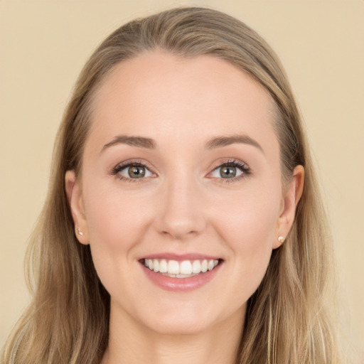 Joyful white young-adult female with long  brown hair and grey eyes