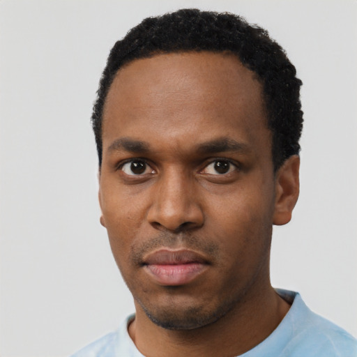 Neutral black young-adult male with short  black hair and brown eyes