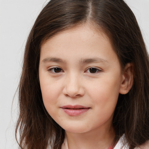 Joyful white child female with long  brown hair and brown eyes