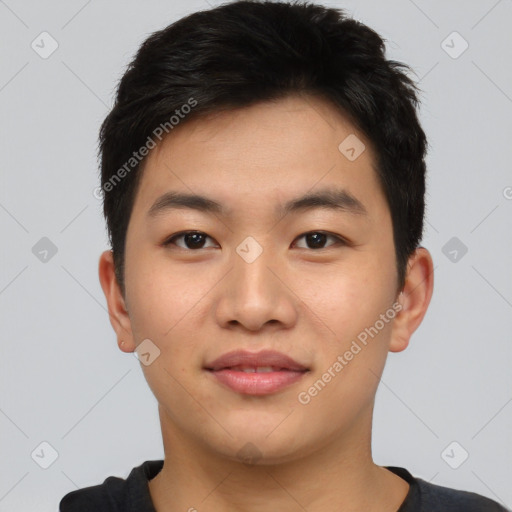 Joyful asian young-adult male with short  black hair and brown eyes