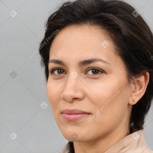 Joyful white adult female with medium  brown hair and brown eyes