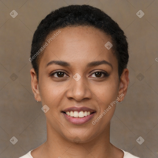 Joyful black young-adult female with short  black hair and brown eyes