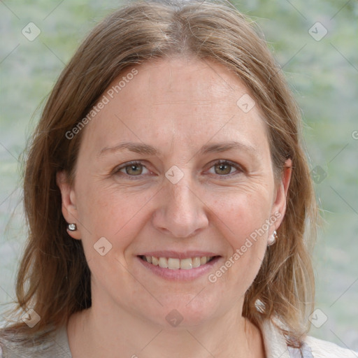 Joyful white adult female with medium  brown hair and blue eyes