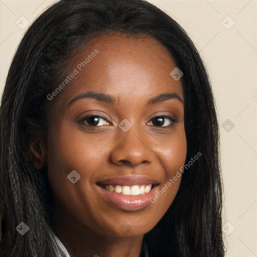 Joyful black young-adult female with long  brown hair and brown eyes