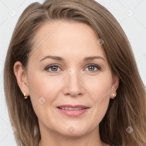 Joyful white adult female with long  brown hair and grey eyes