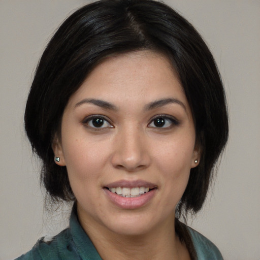 Joyful white young-adult female with medium  black hair and brown eyes