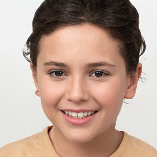 Joyful white child female with short  brown hair and brown eyes